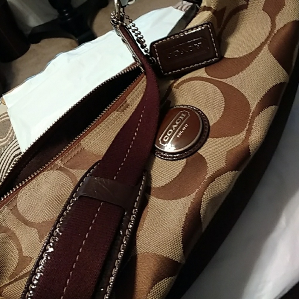 Coach hobo bag will include coach makeup bag free.